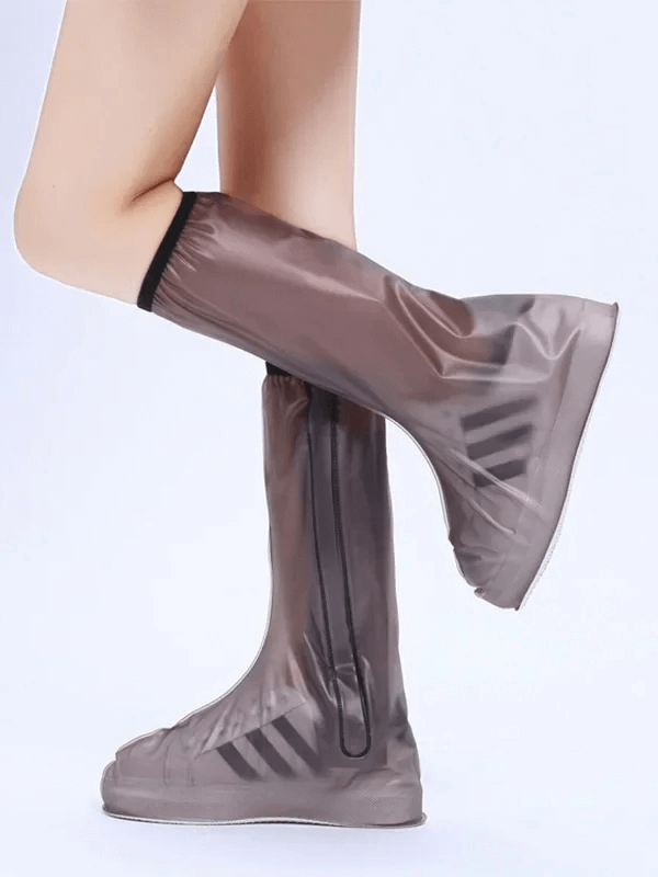 Unisex waterproof silicone boot covers with zipper for easy wear, protecting shoes from rain and mud. Perfect for outdoor use.